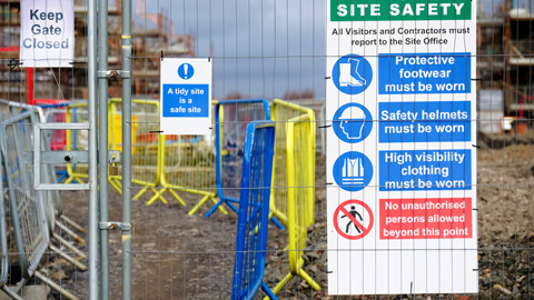 construction site health and safety message rules and sign board on fence